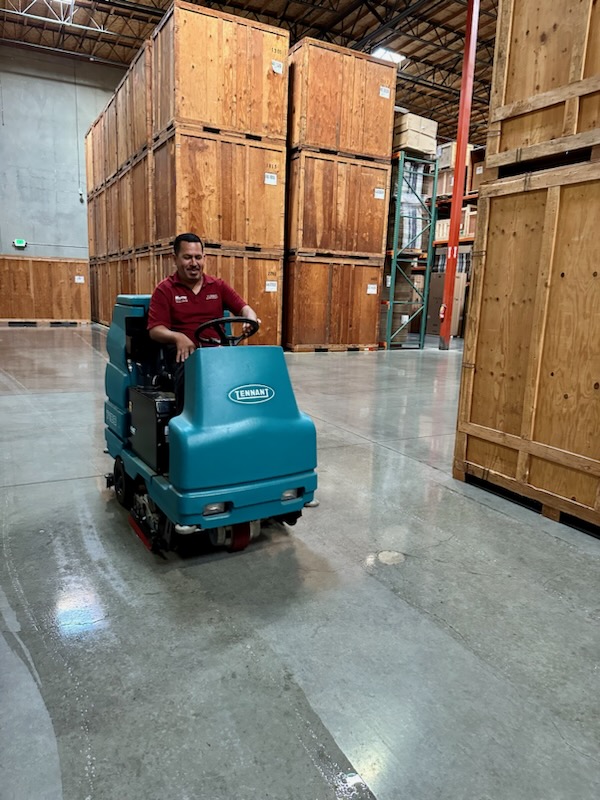 Turner Moving & Storage employee driving through warehouse