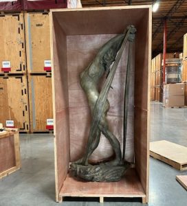 statue of lady in crate cropped