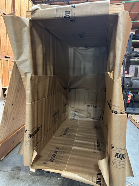 Overseas Shipping. Turner Moving & Storage preps the lift vans with paper and how all items are wrapped in paper pads before they are loaded.