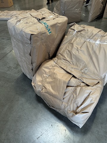 Overseas Shipping. Turner Moving & Storage wraps all items in paper pads before they are loaded into the lift van.